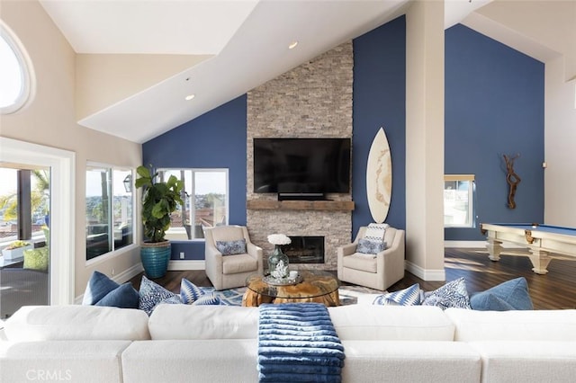 living area featuring billiards, wood finished floors, a fireplace, and high vaulted ceiling