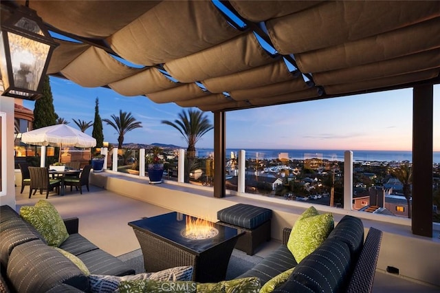 view of patio / terrace with a water view and outdoor dining space