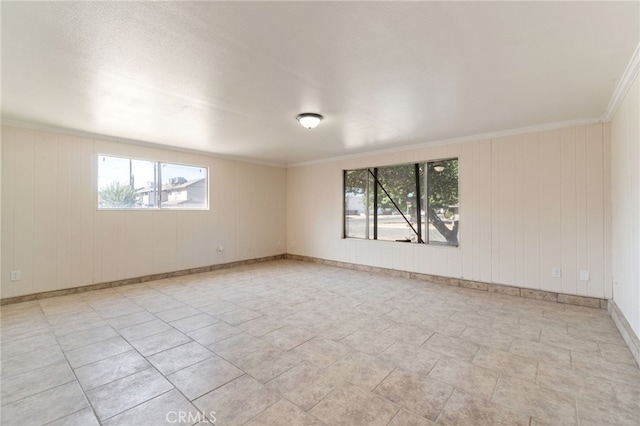 2738 S Fairway Ct, Visalia, CA 93277 - empty room featuring baseboards, a healthy amount of sunlight, and crown molding