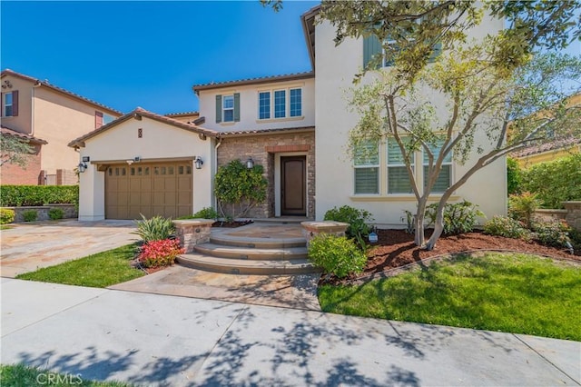 mediterranean / spanish house with stone siding, a tile roof, concrete driveway, a garage, and stucco siding
