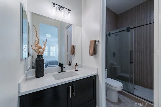 full bathroom with vanity, toilet, and a shower stall