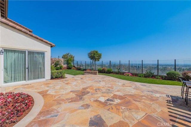 view of patio / terrace featuring fence