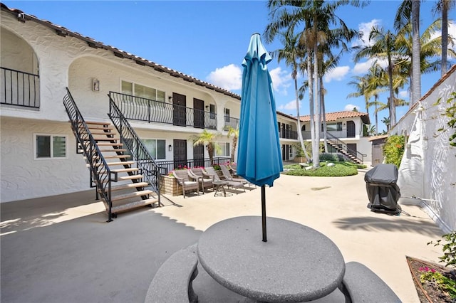 view of patio / terrace featuring stairway and an outdoor hangout area