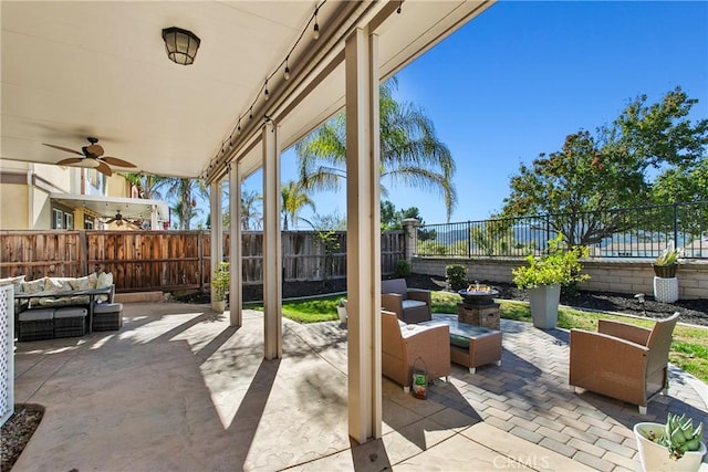 view of patio featuring a fenced backyard, a ceiling fan, and outdoor lounge area