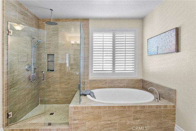 bathroom with a garden tub and a stall shower