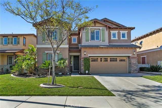 craftsman inspired home featuring concrete driveway, a front yard, stucco siding, and a garage