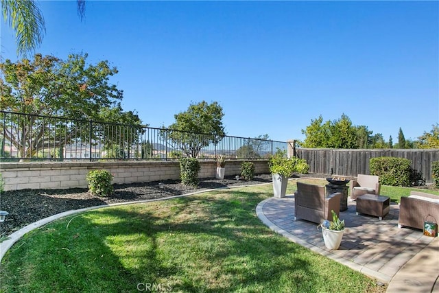 view of yard with a patio area and a fenced backyard