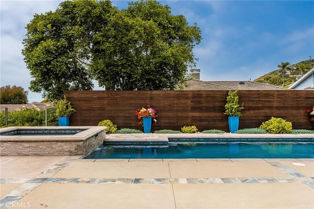 32491 Seven Seas Dr, Dana Point, CA 92629 - view of swimming pool featuring an in ground hot tub, a fenced in pool, fence, and a patio