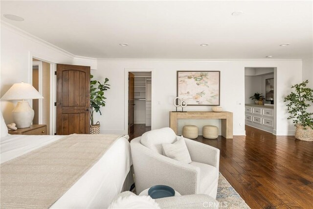 32491 Seven Seas Dr, Dana Point, CA 92629 - bedroom with wood-type flooring, ornamental molding, a spacious closet, baseboards, and recessed lighting