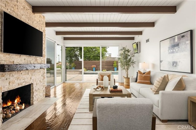 32491 Seven Seas Dr, Dana Point, CA 92629 - living area featuring light wood finished floors, wooden ceiling, beam ceiling, and a stone fireplace