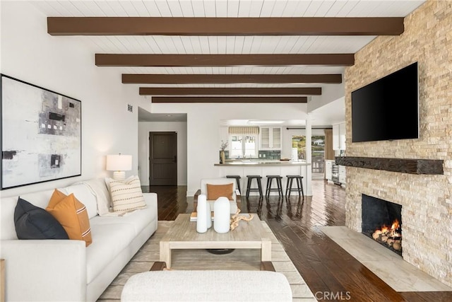 32491 Seven Seas Dr, Dana Point, CA 92629 - living room with a stone fireplace, beam ceiling, wooden ceiling, and hardwood / wood-style floors