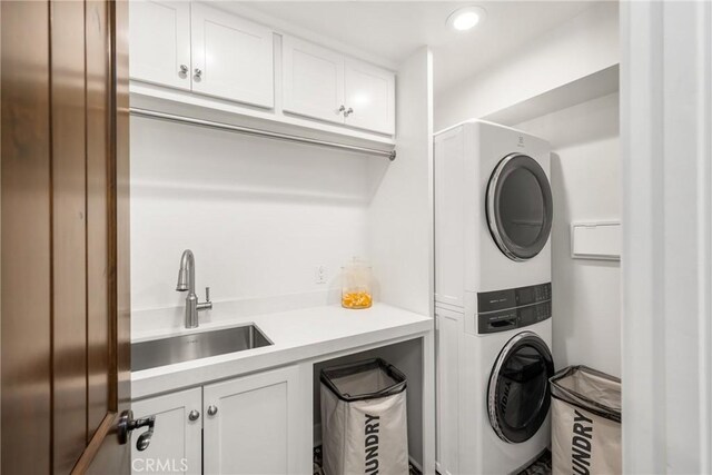 32491 Seven Seas Dr, Dana Point, CA 92629 - laundry room featuring estacked washer and dryer, cabinet space, and recessed lighting
