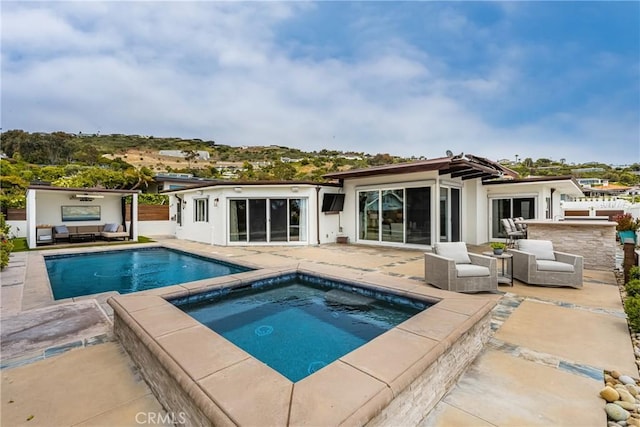 32491 Seven Seas Dr, Dana Point, CA 92629 - back of house with an in ground hot tub, a patio area, a fenced in pool, and an outdoor hangout area