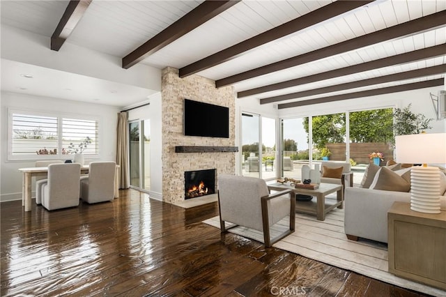 32491 Seven Seas Dr, Dana Point, CA 92629 - living area with a stone fireplace, hardwood / wood-style floors, a healthy amount of sunlight, and beamed ceiling
