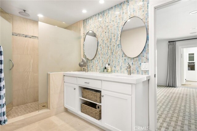 32491 Seven Seas Dr, Dana Point, CA 92629 - bathroom with double vanity, tiled shower, a sink, decorative backsplash, and recessed lighting