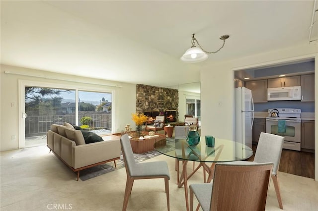 23026 Nadine Cir Unit B, Torrance, CA 90505 - dining room with light carpet and a fireplace