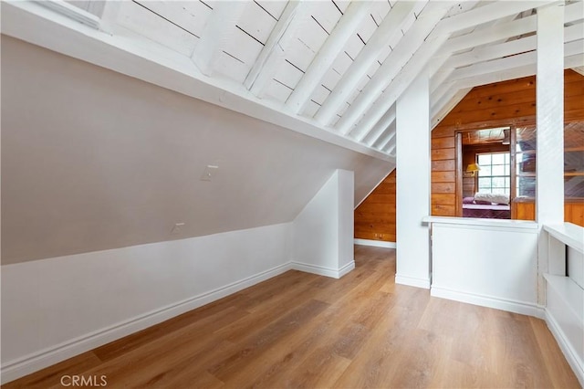 356 Wylerhorn Dr, Crestline, CA 92325 - bonus room with baseboards, wooden walls, wood finished floors, and lofted ceiling with beams