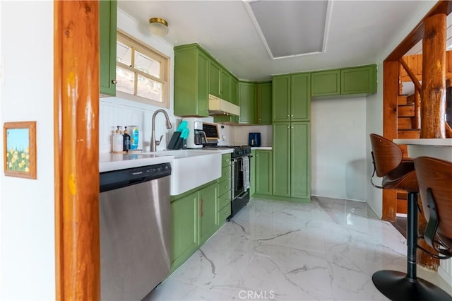 356 Wylerhorn Dr, Crestline, CA 92325 - kitchen with under cabinet range hood, stainless steel dishwasher, black range with gas stovetop, green cabinetry, and light countertops
