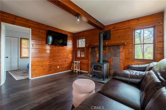 356 Wylerhorn Dr, Crestline, CA 92325 - living room featuring a wood stove, dark wood-style floors, plenty of natural light, and beam ceiling