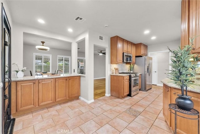 kitchen with recessed lighting, visible vents, appliances with stainless steel finishes, and decorative backsplash