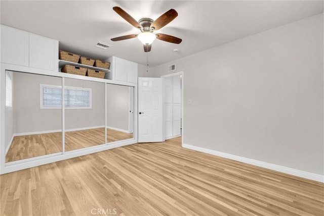 unfurnished bedroom with a ceiling fan, a closet, light wood-style flooring, baseboards, and visible vents