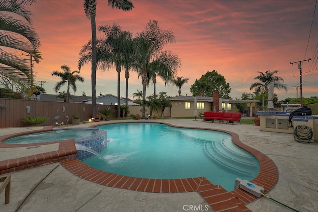 view of swimming pool with a fenced backyard, a patio area, outdoor lounge area, and a pool with connected hot tub
