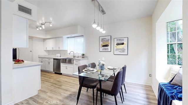 11725 Lemay St Unit 1, North Hollywood, CA 91606 - dining space featuring light wood finished floors, visible vents, and baseboards