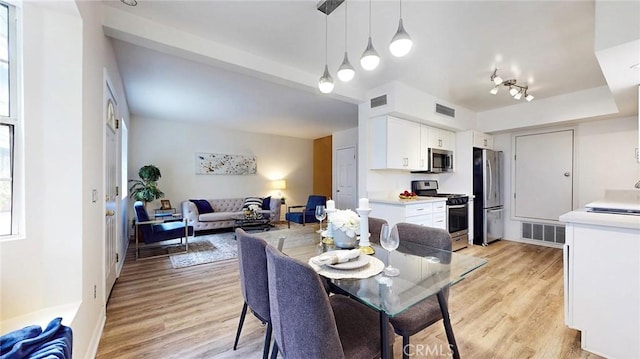 11725 Lemay St Unit 1, North Hollywood, CA 91606 - dining space with light wood-type flooring and visible vents