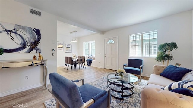 11725 Lemay St Unit 1, North Hollywood, CA 91606 - living area with a chandelier, baseboards, light wood-type flooring, and visible vents