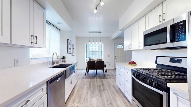 11725 Lemay St Unit 1, North Hollywood, CA 91606 - kitchen featuring light wood-style floors, light countertops, and appliances with stainless steel finishes
