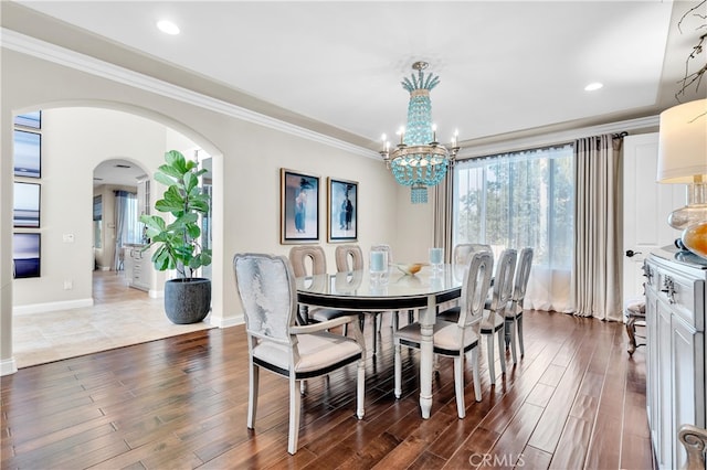 9420 Oak Leaf Dr, Chatsworth, CA 91311 - dining space featuring ornamental molding, a wealth of natural light, arched walkways, and a notable chandelier