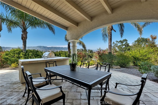 9420 Oak Leaf Dr, Chatsworth, CA 91311 - view of patio featuring exterior kitchen, a mountain view, and outdoor dining area