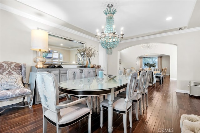 9420 Oak Leaf Dr, Chatsworth, CA 91311 - dining room with visible vents, a chandelier, crown molding, dark wood-type flooring, and arched walkways