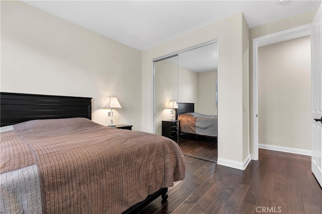 9420 Oak Leaf Dr, Chatsworth, CA 91311 - bedroom featuring a closet, baseboards, and hardwood / wood-style floors