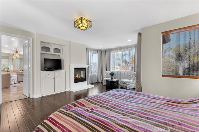 9420 Oak Leaf Dr, Chatsworth, CA 91311 - bedroom featuring recessed lighting, wood finished floors, and a glass covered fireplace