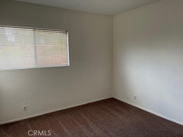 7215 Goldboro Ln, Riverside, CA 92506 - empty room featuring dark carpet and baseboards