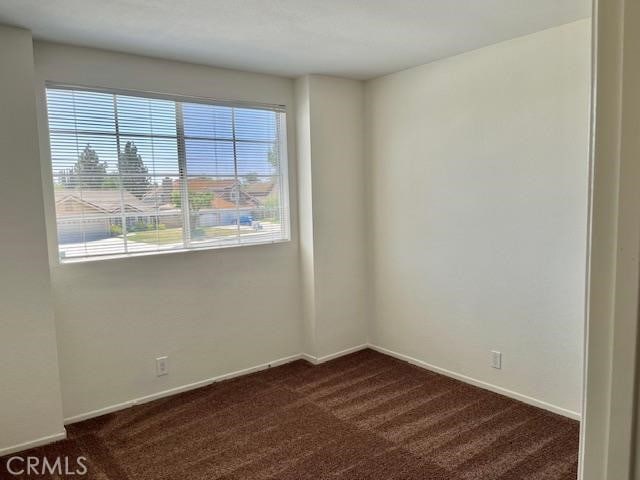 7215 Goldboro Ln, Riverside, CA 92506 - empty room with dark colored carpet