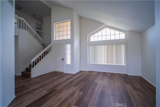 7215 Goldboro Ln, Riverside, CA 92506 - entrance foyer featuring stairway, dark wood finished floors, healthy amount of natural light, and high vaulted ceiling
