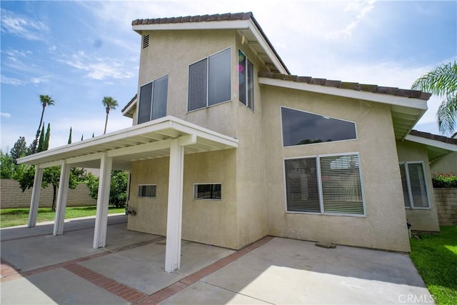 7215 Goldboro Ln, Riverside, CA 92506 - rear view of property with stucco siding and a patio