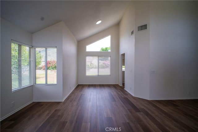 7215 Goldboro Ln, Riverside, CA 92506 - unfurnished living room with healthy amount of natural light, dark wood-type flooring, and high vaulted ceiling