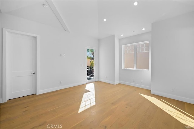spare room with baseboards, light wood-type flooring, and recessed lighting