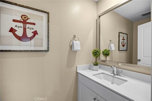 bathroom featuring visible vents and vanity