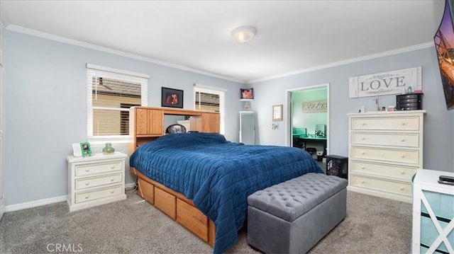 bedroom featuring crown molding, baseboards, and carpet