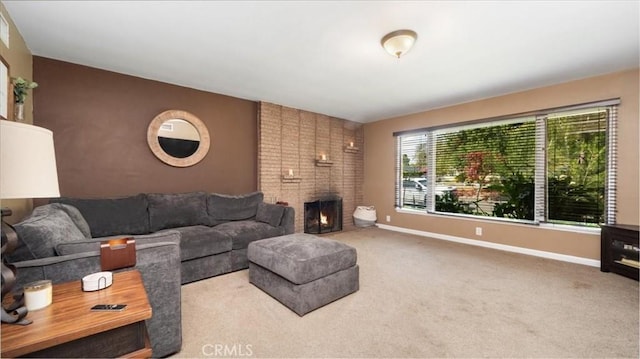 living area featuring a brick fireplace, carpet floors, and baseboards