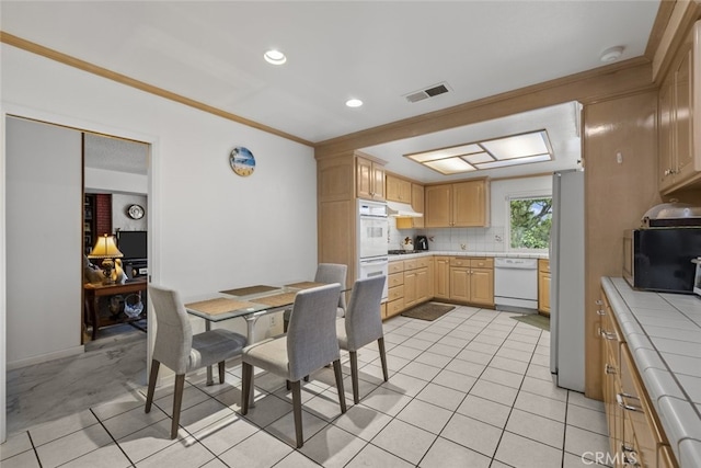 10661 Baton Rouge Ave, Porter Ranch, CA 91326 - kitchen featuring tasteful backsplash, white appliances, tile countertops, visible vents, and light brown cabinets