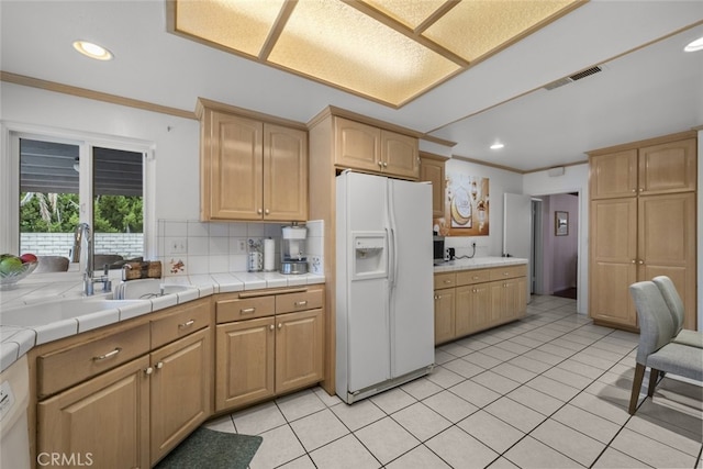 10661 Baton Rouge Ave, Porter Ranch, CA 91326 - kitchen with white fridge with ice dispenser, light brown cabinets, crown molding, and a sink