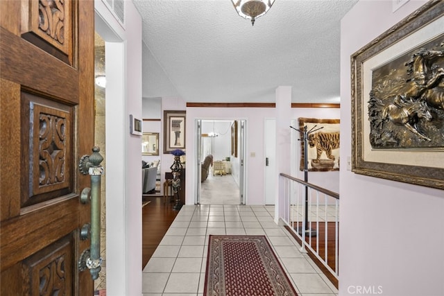 10661 Baton Rouge Ave, Porter Ranch, CA 91326 - foyer entrance featuring light tile patterned flooring and a textured ceiling