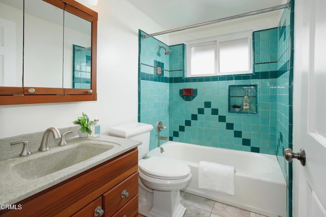 full bathroom featuring toilet, tile patterned flooring, vanity, and shower / bathtub combination