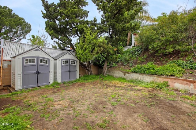 view of yard with an outdoor structure and a shed