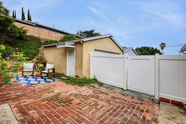 view of patio / terrace with a gate and fence